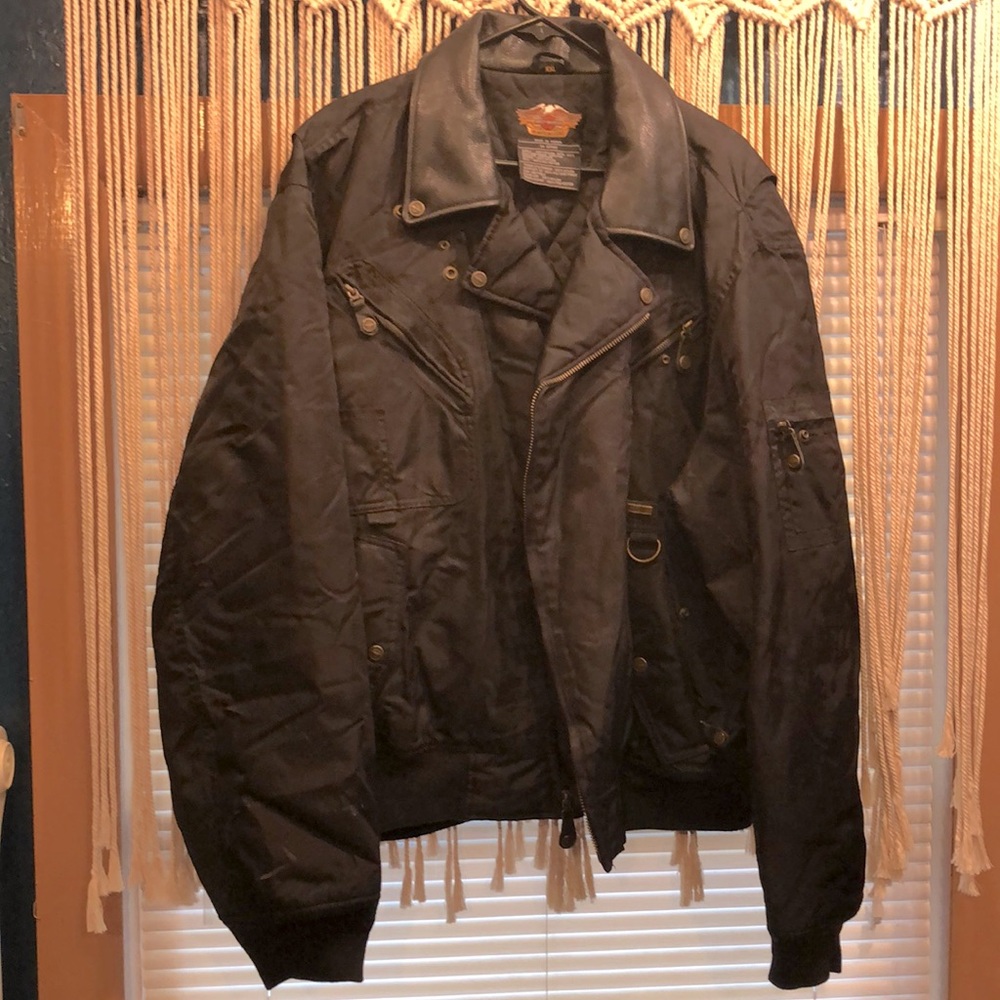 Harley Davison nylon jacket with leather collar. Good shape. A few blemishes.